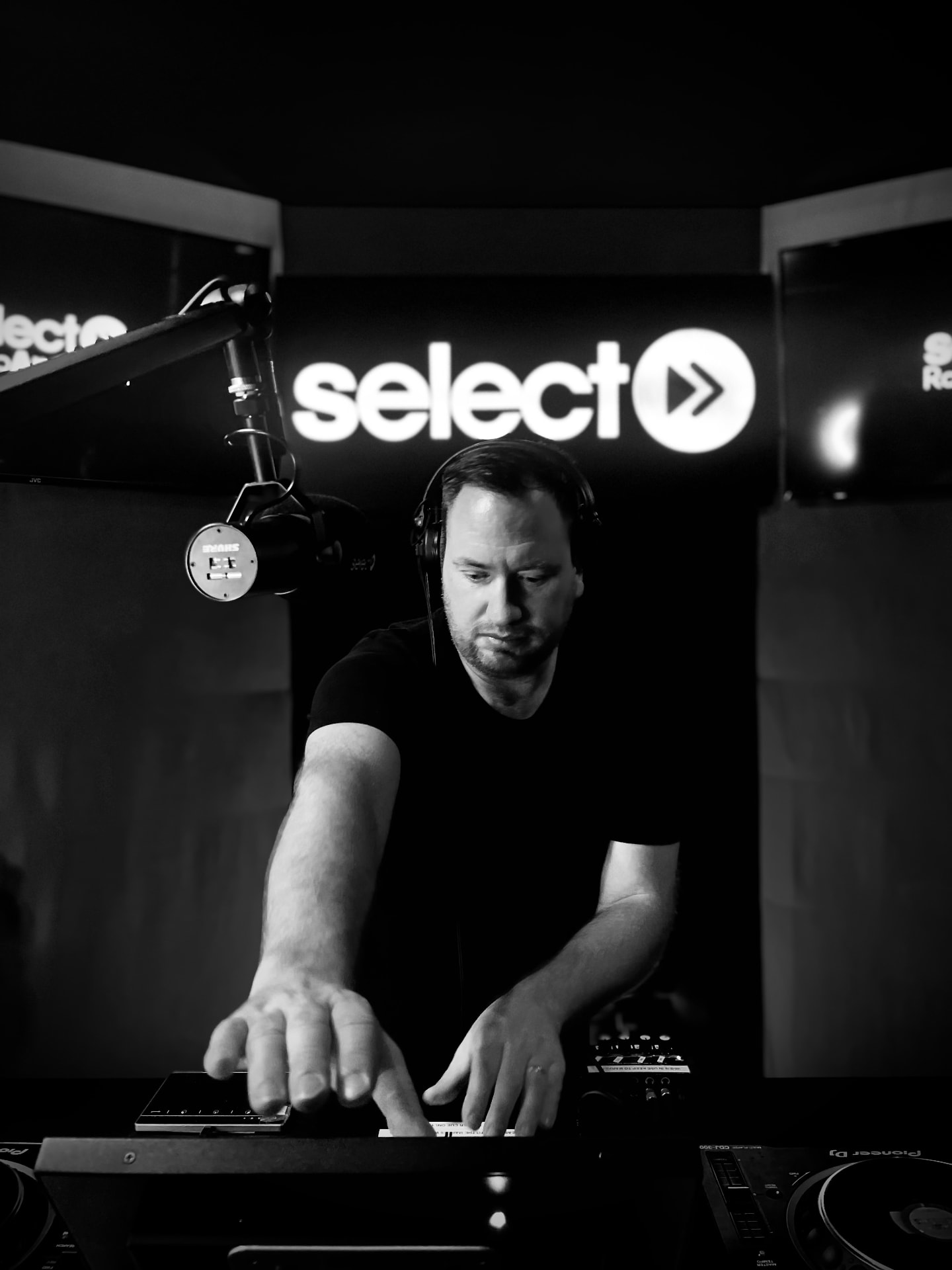Darrell Lee at the mixer in the Select Radio studio