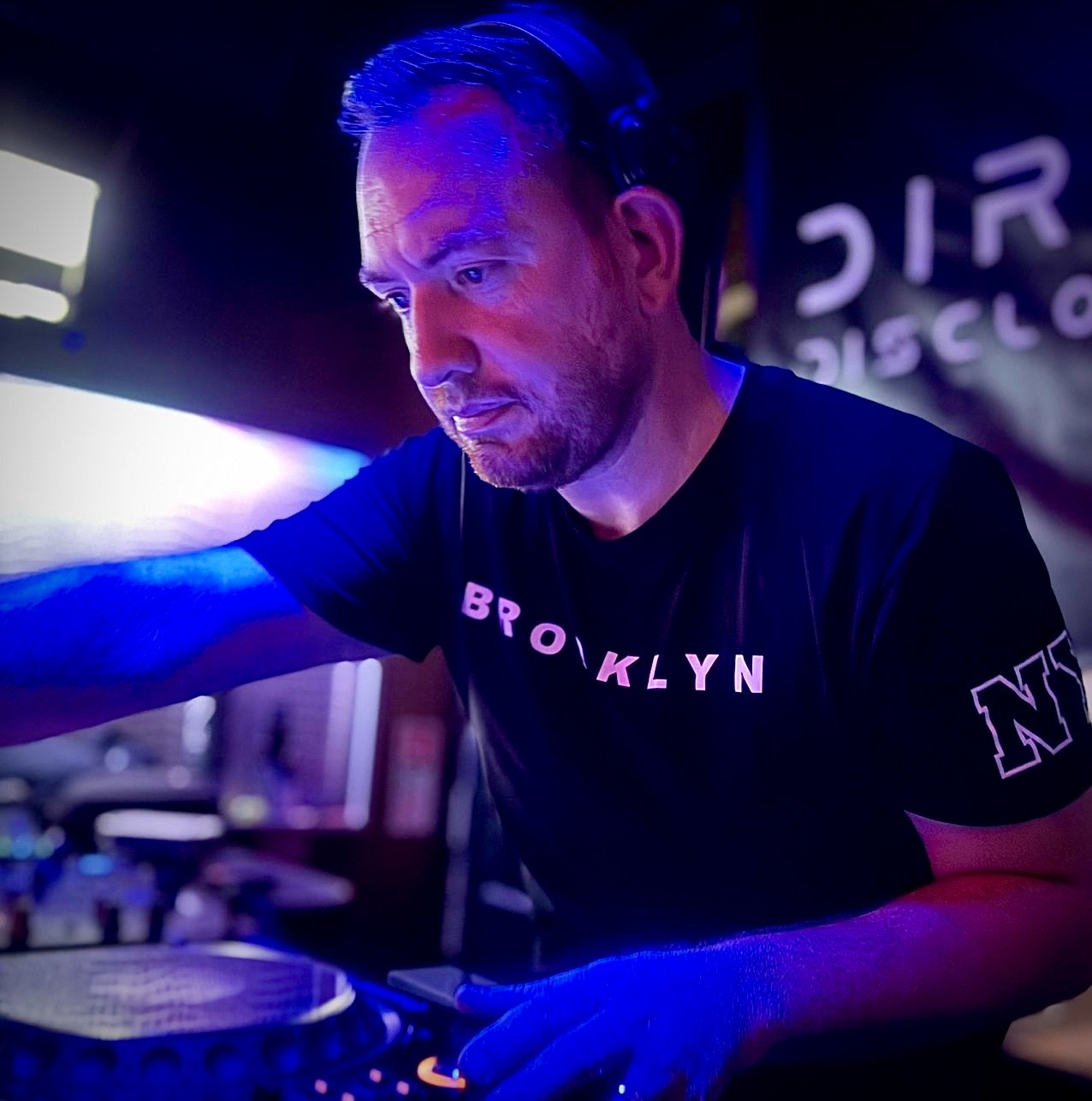 Darrell Lee behind the mixer in blue light
